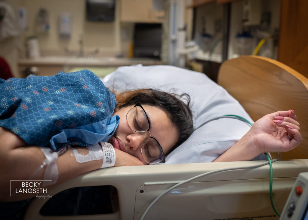 A woman takes a break laying in her hospital bed as she labor at St. Michael's Medical Center in Silverdale, WA. 