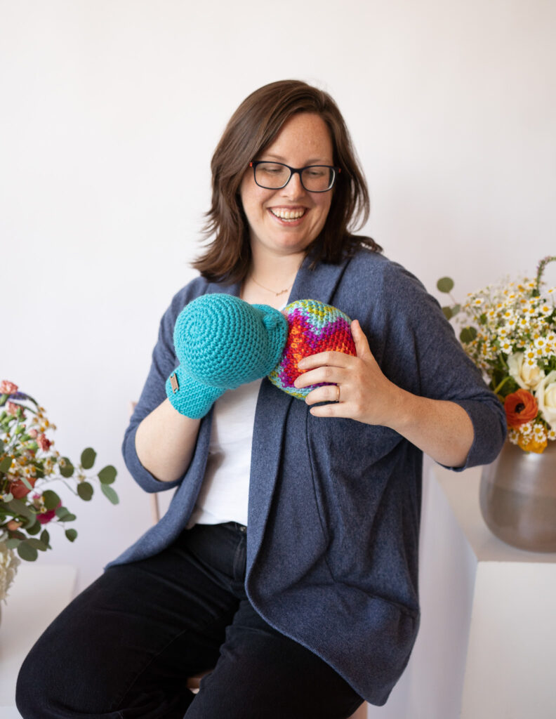 Rachael Katz, Certified Lactation Educator, demonstrates how to obtain a proper latch with a breastfeeding crochet puppet. 