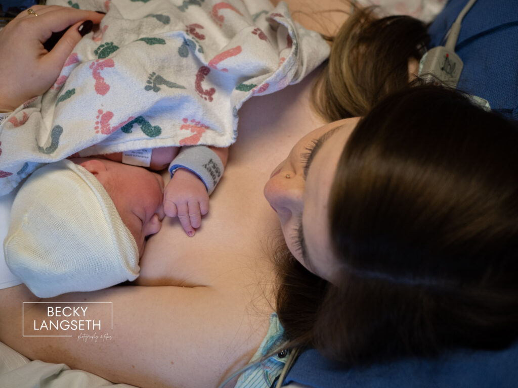 A mother holds her baby for the first time after giving birth. 