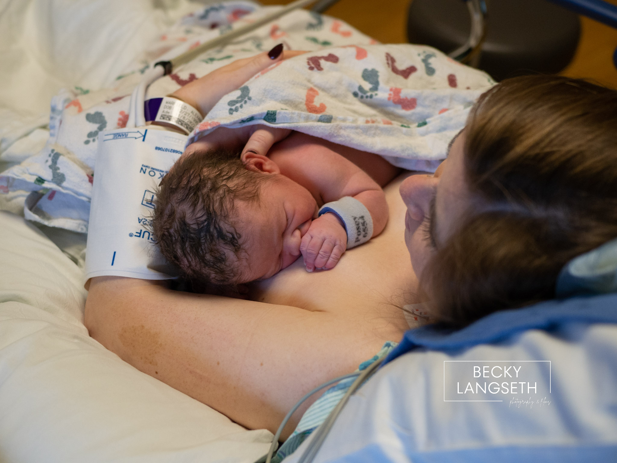 A new mother holds her baby doing skin-to-skin for the first time after a cesarian birth at Swedish Issaquah Hospital.