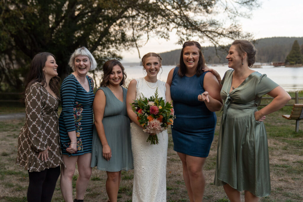 Bride laughs with her friends before the wedding