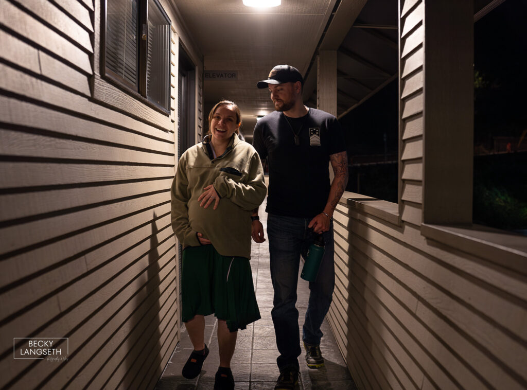 a pregnant mom and her husband walk outside a birth center to help labor to progress