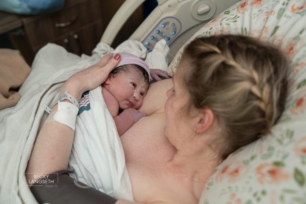 mother holding baby on her chest after giving birth