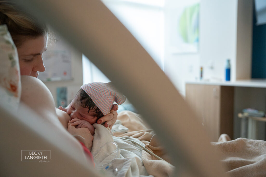 mother breastfeeding her newly born baby