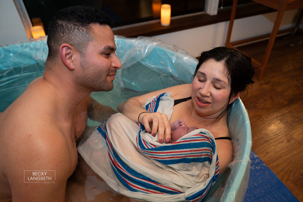 first reaction to holding her baby after giving birth at home in Sammamish